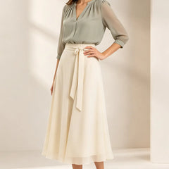 Refined chiffon wedding guest dress by THE WHITMORE FAMILY, featuring elegant flowy fabric and a sophisticated design.