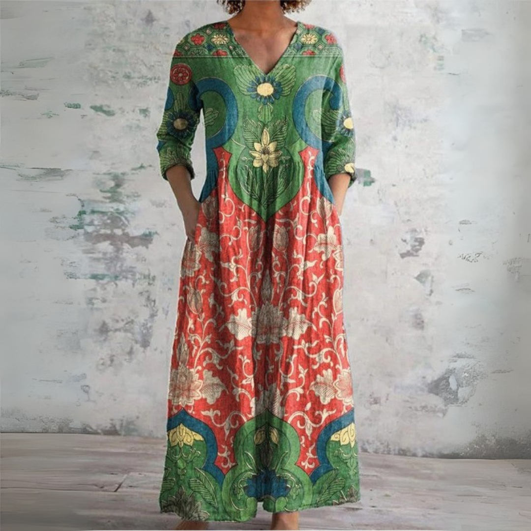 Multicolor vintage floral maxi dress by THE WHITMORE FAMILY featuring a flowing silhouette and elegant floral pattern.