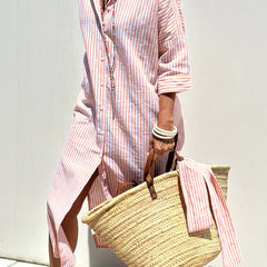 Pink striped shirt dress by THE WHITMORE FAMILY, featuring a classic, elegant design with comfortable fit and button-front style.
