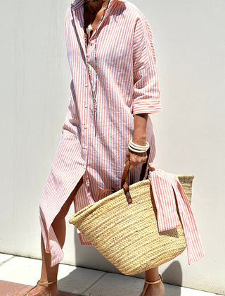 Pink striped shirt dress by THE WHITMORE FAMILY, featuring a classic, elegant design with comfortable fit and button-front style.