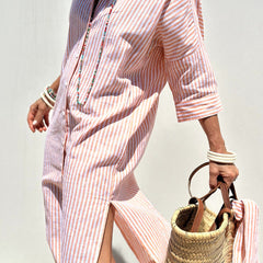 Pink Sophia striped shirt dress by THE WHITMORE FAMILY, featuring a classic design and elegant, comfortable fit.