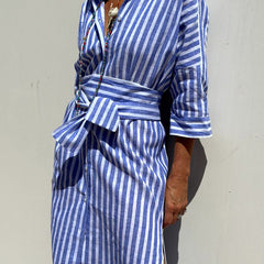 Pink Sophia striped shirt dress by THE WHITMORE FAMILY, featuring a classic design, collar, button front, and comfortable fit.