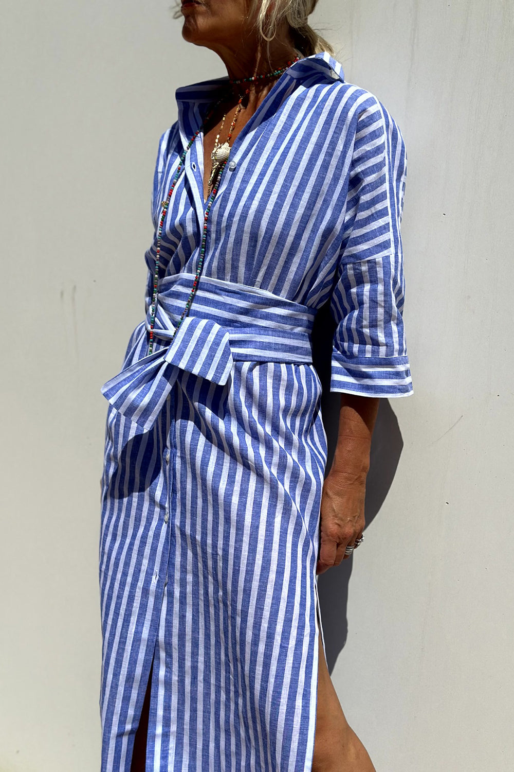 Pink Sophia striped shirt dress by THE WHITMORE FAMILY, featuring a classic design, collar, button front, and comfortable fit.