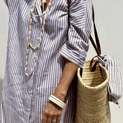 Pink Sophia striped shirt dress by THE WHITMORE FAMILY, featuring a classic design and comfortable fit, shown on a model.