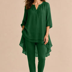 Elegant emerald overlay pant dress by THE WHITMORE FAMILY, designed for formal occasions, featuring sophisticated detailing and a chic silhouette.