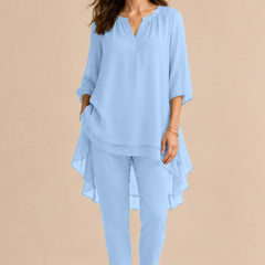 Seraphina Elegant Overlay Pant Ensemble dress by THE WHITMORE FAMILY, featuring a stylish cloud blue pant suit with elegant overlay details.