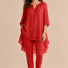 Seraphina elegant overlay pant dress by THE WHITMORE FAMILY, featuring a stylish red pant suit with intricate overlay details.