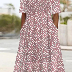 Women’s rose-colored Romy midi dress by THE WHITMORE FAMILY, featuring a tummy covering design and feminine style.