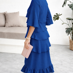 Black Patricia ruffle dress by THE WHITMORE FAMILY featuring elegant design and comfortable fit, perfect for stylish occasions.