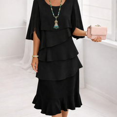 Black Patricia ruffle dress by THE WHITMORE FAMILY featuring elegant comfort and stylish design.
