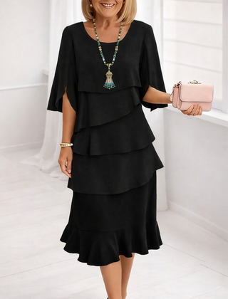 Black Patricia ruffle dress by THE WHITMORE FAMILY featuring elegant comfort and stylish design.