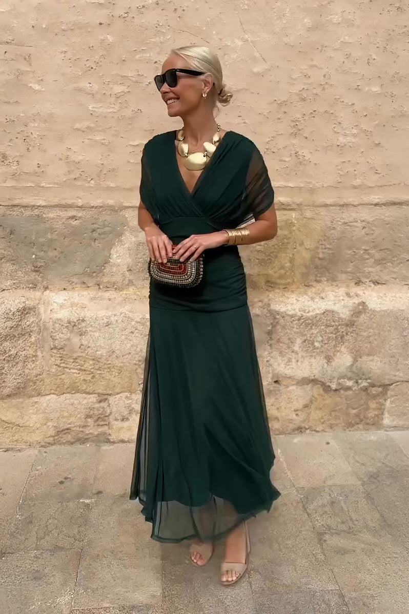 Bottle green Emma elegant maxi party dress by THE WHITMORE FAMILY, featuring a flowing design and sophisticated style.