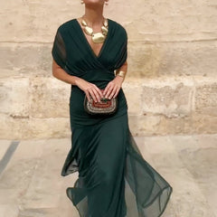 Bottle green Emma elegant maxi party dress by THE WHITMORE FAMILY, featuring a flowing silhouette and sophisticated design.