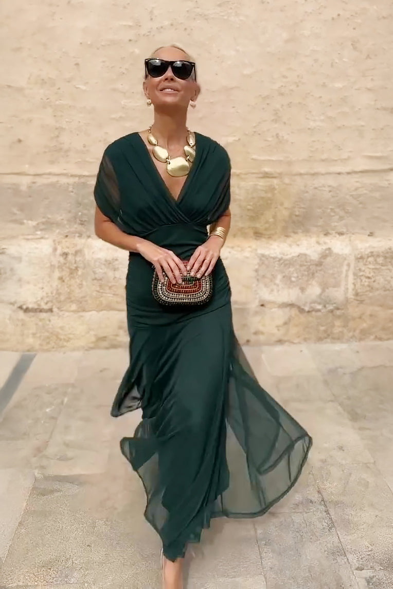 Bottle green Emma elegant maxi party dress by THE WHITMORE FAMILY, featuring a flowing silhouette and sophisticated design.