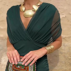 Bottle green Emma elegant maxi party dress by THE WHITMORE FAMILY, featuring a flowing silhouette and stylish design.