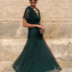 Bottle green Emma elegant maxi party dress by THE WHITMORE FAMILY, featuring a flowing design and sophisticated style.