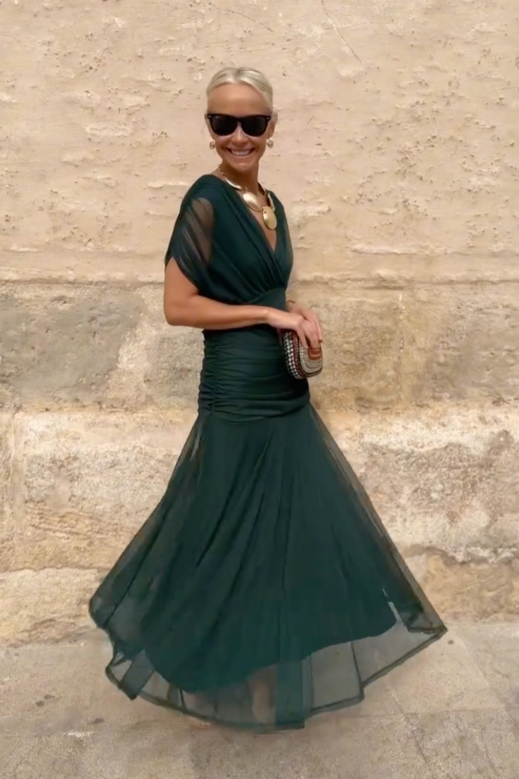Bottle green Emma elegant maxi party dress by THE WHITMORE FAMILY, featuring a flowing design and sophisticated style.