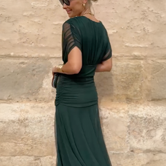 Bottle green Emma maxi party dress by THE WHITMORE FAMILY, elegant flowing dress with a fitted bodice and full-length skirt.