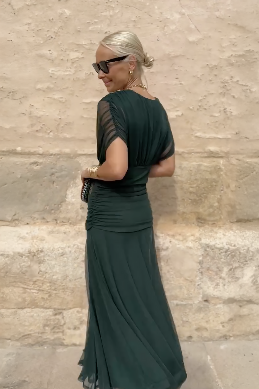 Bottle green Emma maxi party dress by THE WHITMORE FAMILY, elegant flowing dress with a fitted bodice and full-length skirt.