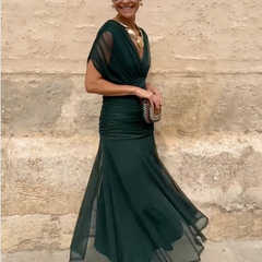 Bottle green Emma elegant maxi party dress by THE WHITMORE FAMILY, featuring a flowing design and sophisticated style.