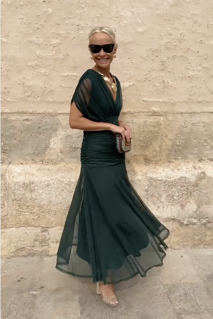 Bottle green Emma elegant maxi party dress by THE WHITMORE FAMILY, featuring a flowing design and sophisticated style.