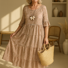 Brown Iris Sable Midi Dress by THE WHITMORE FAMILY featuring a flowy silhouette and elegant design.