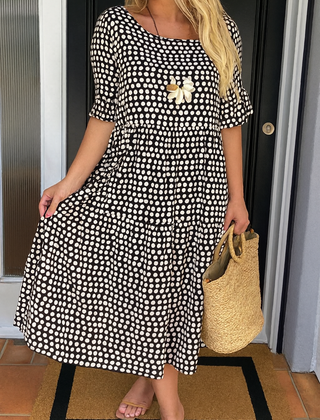 Brown Iris Sable Midi Dress by THE WHITMORE FAMILY, featuring a flowing silhouette and elegant design for stylish wear.
