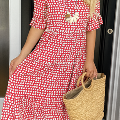 Brown Iris Sable Midi Dress by THE WHITMORE FAMILY, displayed on a mannequin, featuring a fitted waist and flowing skirt.