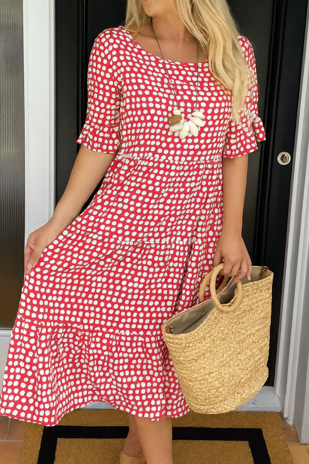 Brown Iris Sable Midi Dress by THE WHITMORE FAMILY, displayed on a mannequin, featuring a fitted waist and flowing skirt.