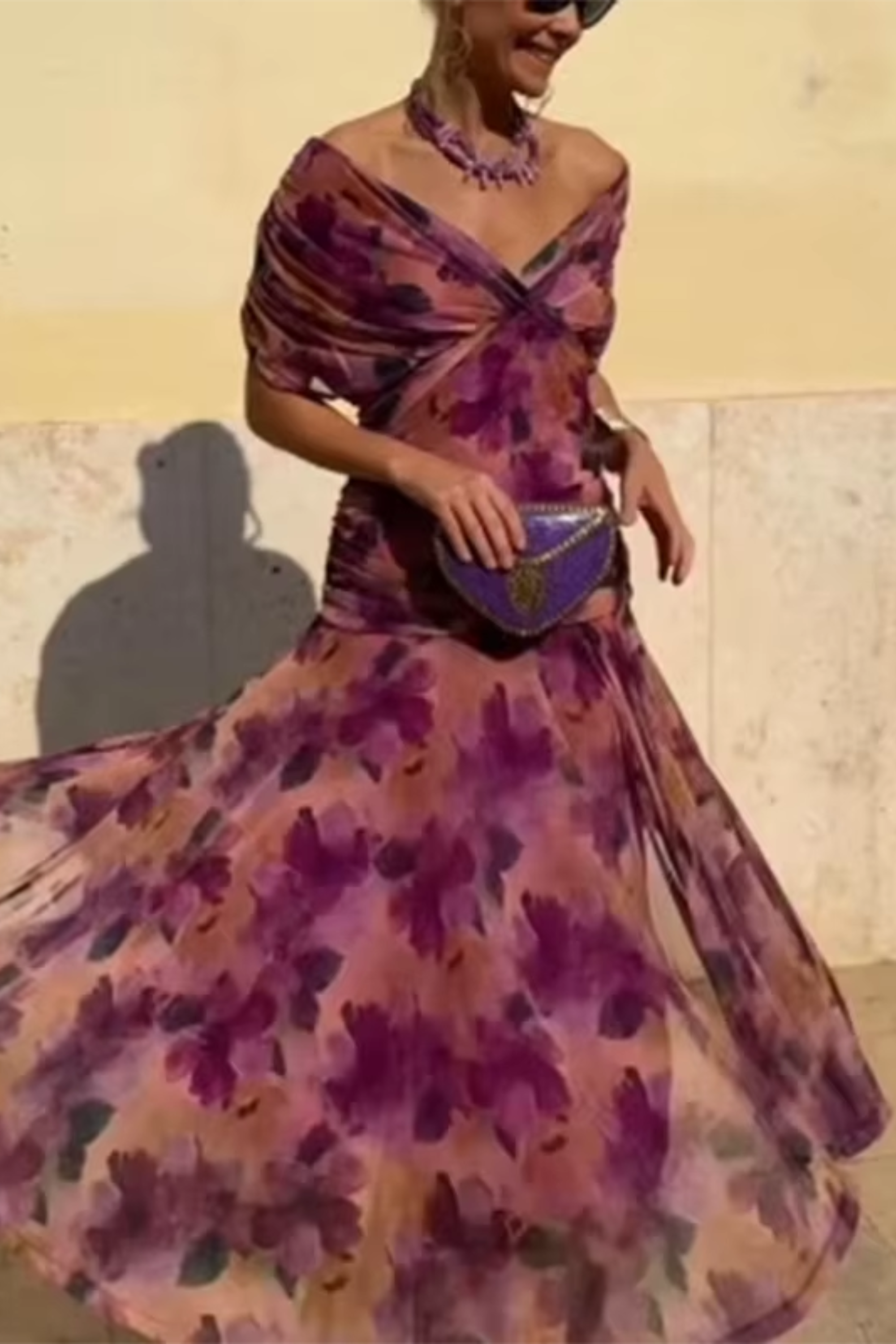 Hendrika Coral Glow evening dress by THE WHITMORE FAMILY with flowing fabric and elegant design, suitable for formal occasions.