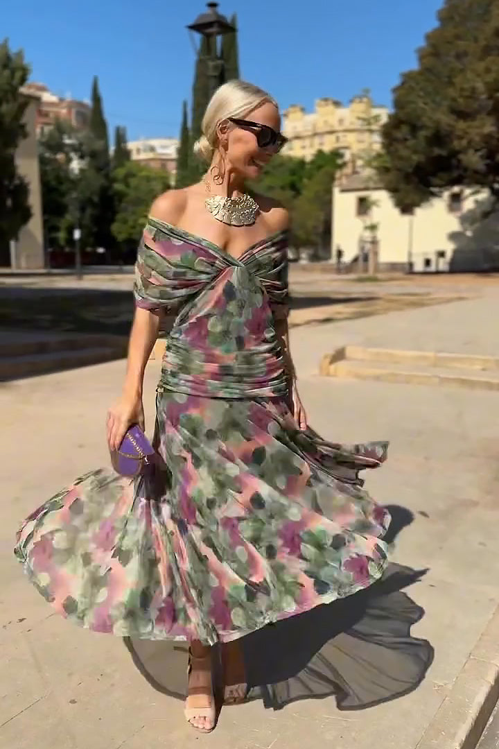 Hendrika Coral Glow Evening Dress by THE WHITMORE FAMILY featuring elegant design and vibrant coral color in a garden setting