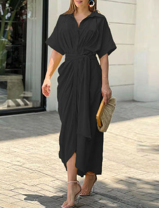 Green Tahlia casual dress by THE WHITMORE FAMILY, elegant and stylish, featuring a fitted bodice and flowing skirt.