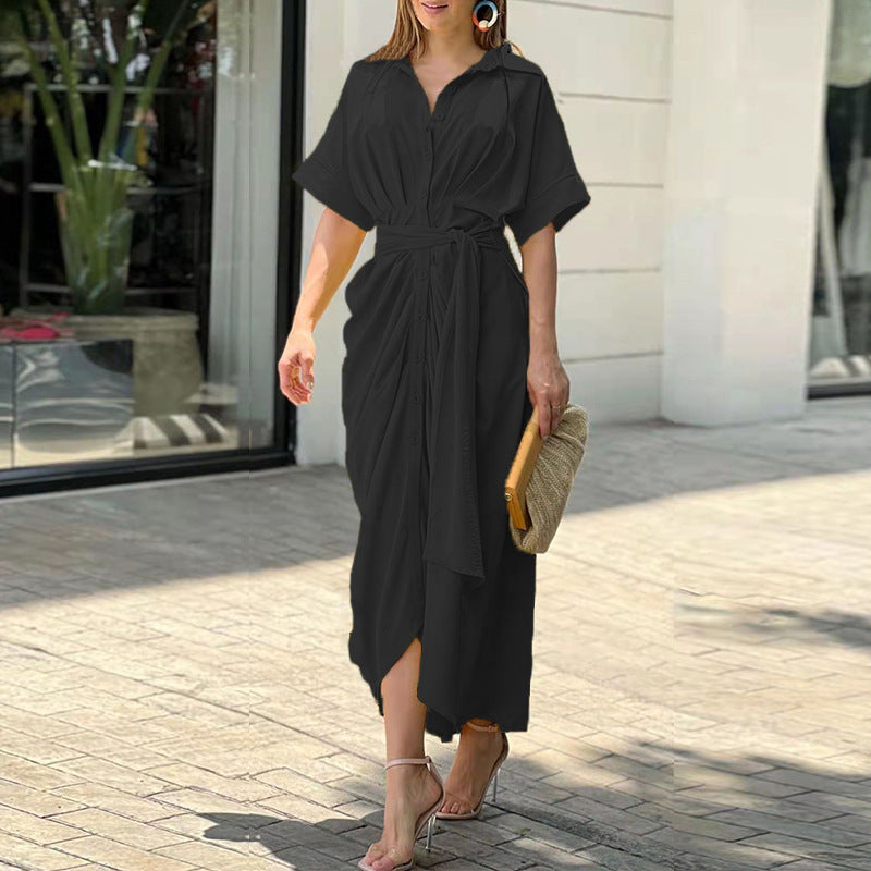 Green Tahlia casual dress by THE WHITMORE FAMILY, elegant and stylish, featuring a fitted bodice and flowing skirt.