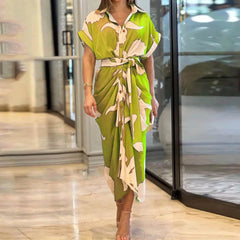 Green Tahlia casual dress by THE WHITMORE FAMILY, elegant and stylish, featuring a comfortable fit and classic design.