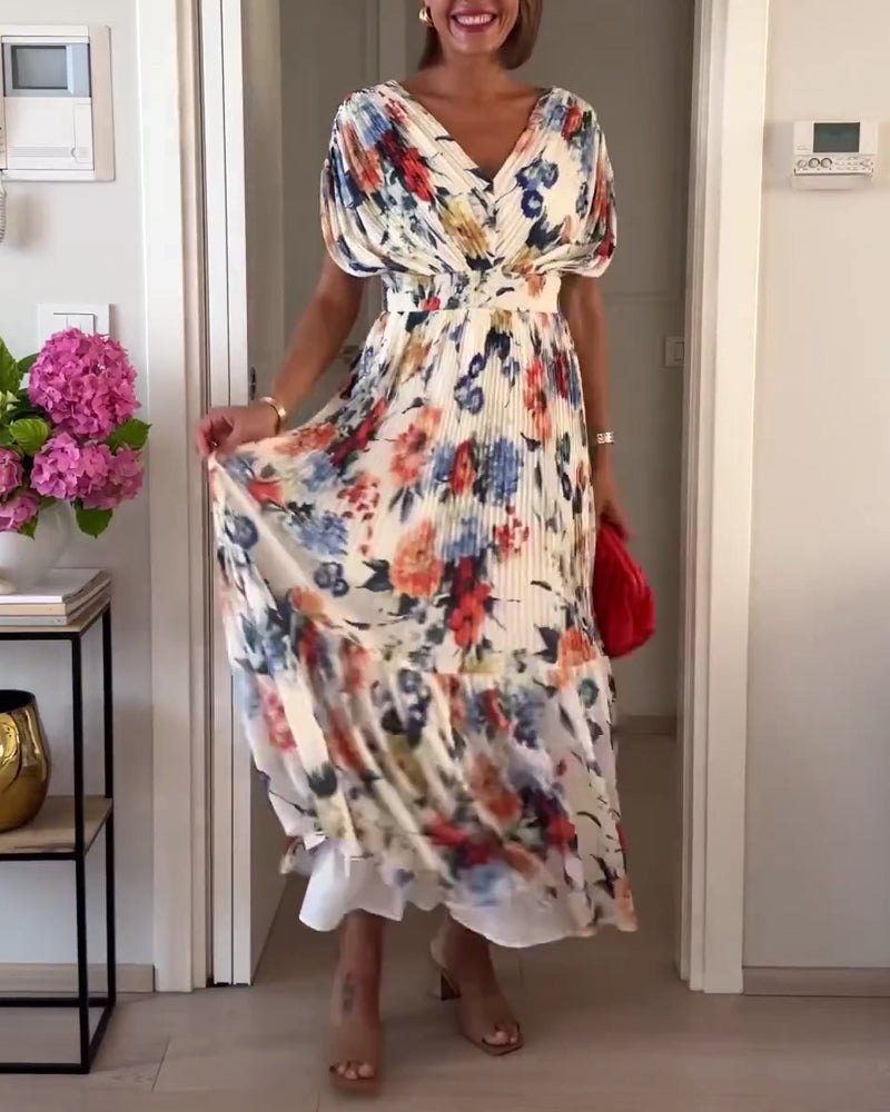 Elegant Florelle floral dress by THE WHITMORE FAMILY, showcased with intricate floral pattern and flowing fabric.