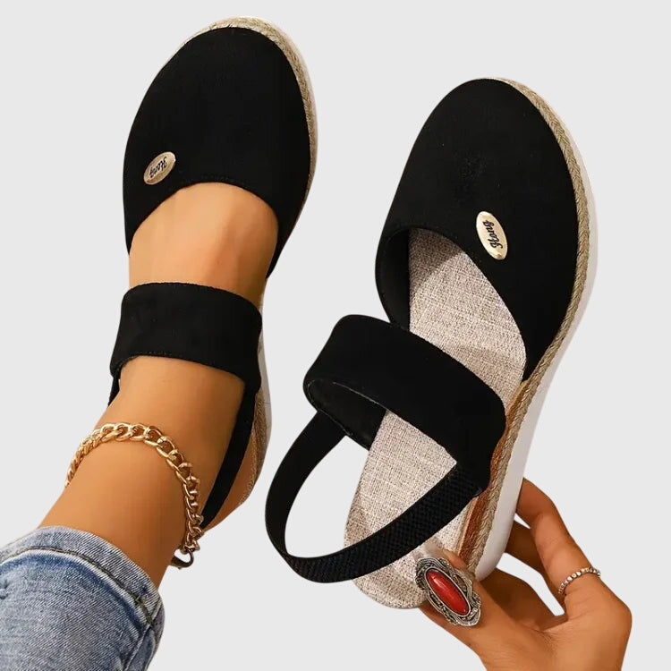Beige Antonia™ ELUXOR orthopedic sandals by THE WHITMORE FAMILY, featuring supportive design and comfortable straps.