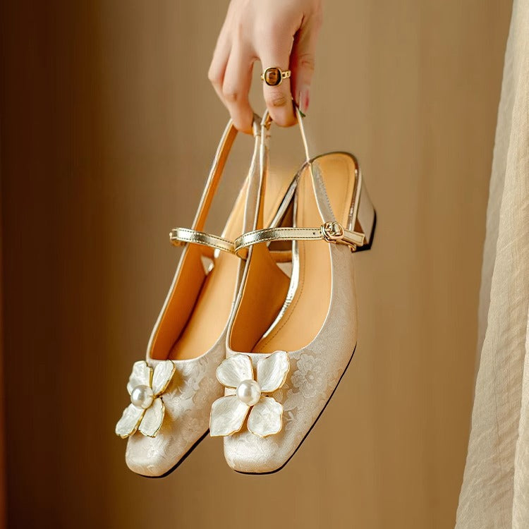 Beige Eloise flat sandals by THE WHITMORE FAMILY featuring chic, elegant design with open toes and comfortable flat soles.