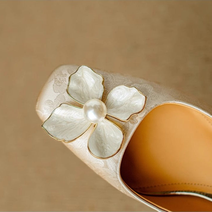Beige Eloise flat sandals from THE WHITMORE FAMILY featuring chic, elegant design and comfortable slip-on style.
