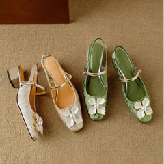 Beige Eloise chic elegant flat sandals by THE WHITMORE FAMILY with stylish straps and comfortable design.