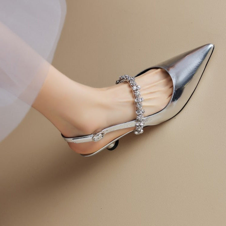 Silver THE WHITMORE FAMILY Isabelle casual flat sandals with elegant design and open-toe style.