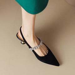 Silver THE WHITMORE FAMILY Isabelle flat sandals with elegant casual pump style, featuring a sleek design and open toe.