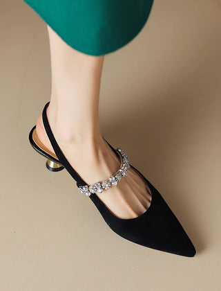 Silver THE WHITMORE FAMILY Isabelle flat sandals with elegant casual pump style, featuring a sleek design and open toe.