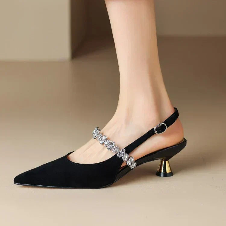 Silver flat sandals from THE WHITMORE FAMILY's Isabelle collection, stylish casual pumps with elegant design.