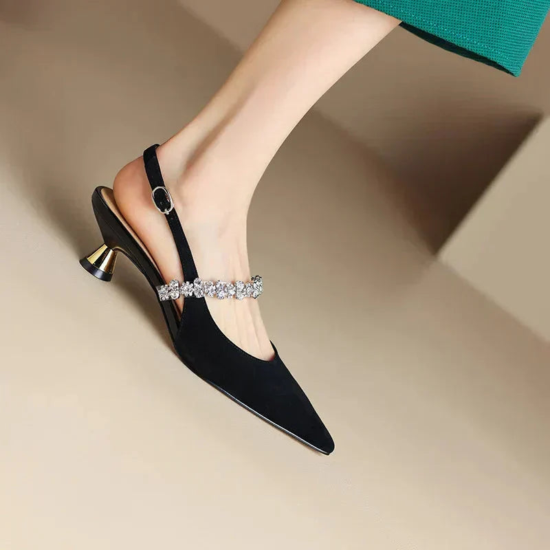 Silver THE WHITMORE FAMILY Isabelle flat sandals with elegant casual pump design, featuring a sleek, comfortable slip-on style.