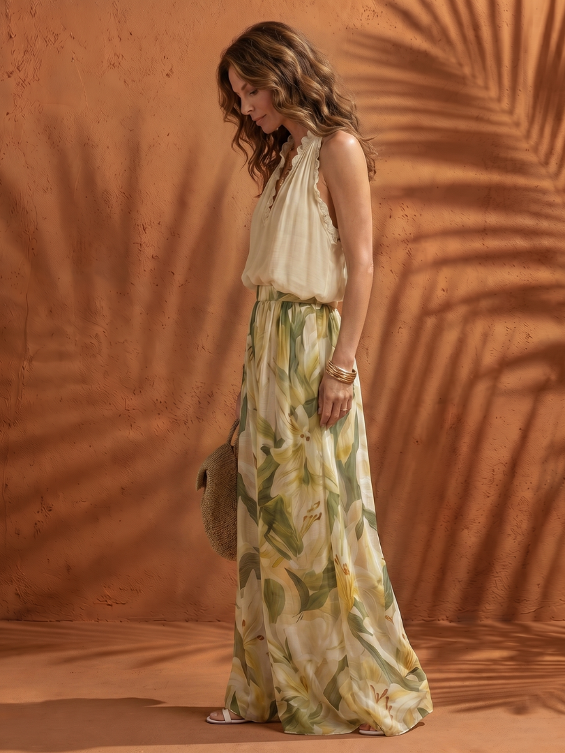 Solange floral halter neck blouse and wide-leg pants set by THE WHITMORE FAMILY, featuring a vibrant floral pattern and relaxed fit.
