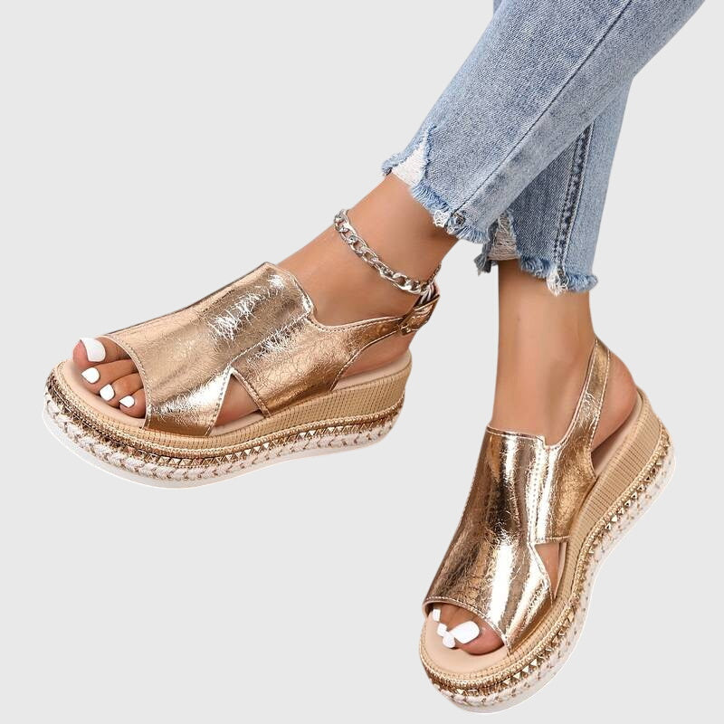 Helen orthopedic sandals by THE WHITMORE FAMILY, featuring gold straps and cushioned sole for comfortable wear.