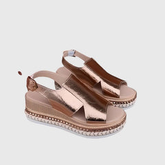 Helen orthopedic sandals by THE WHITMORE FAMILY in gold with supportive soles and open-toe design.
