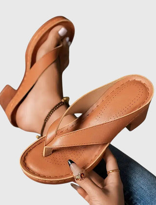 Gold Gianna™ orthopedic sandals by THE WHITMORE FAMILY featuring supportive straps and cushioned soles for comfortable wear.