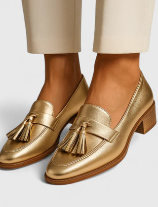 Gold Syrelle all-day comfort loafers by THE WHITMORE FAMILY, stylish leather slip-ons with cushioned insoles for everyday wear.