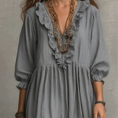 Gray boho long sleeve maxi dress by THE WHITMORE FAMILY, featuring a flowing silhouette and relaxed style.